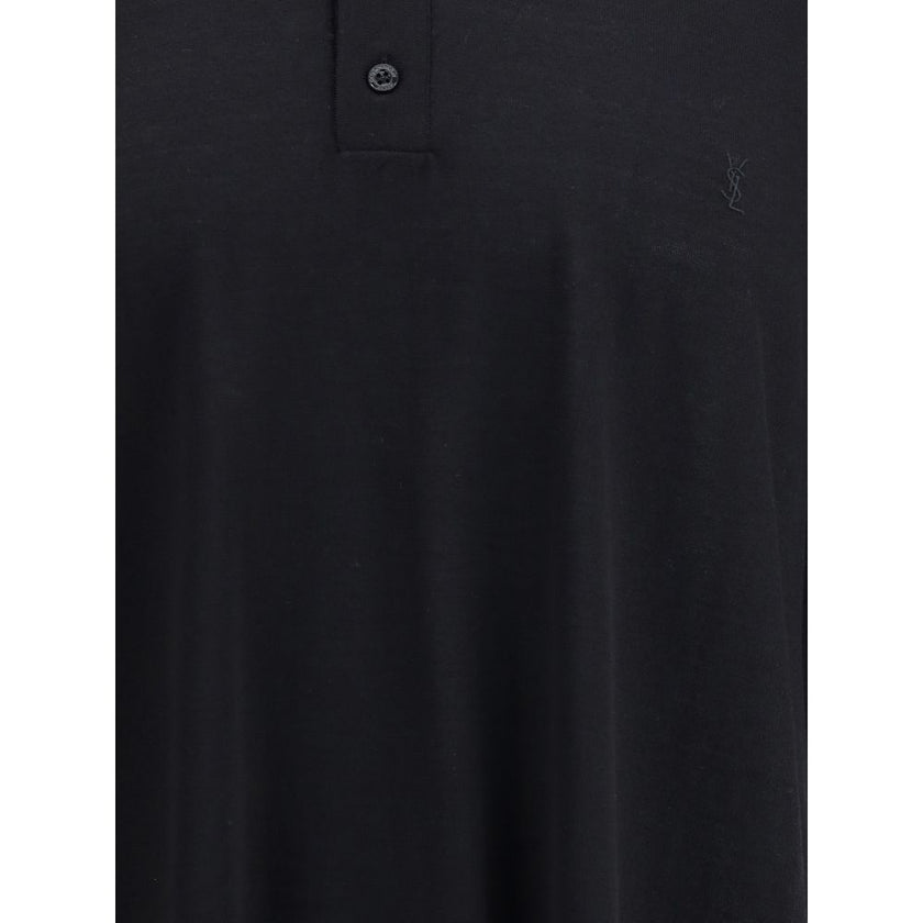 Black Wool Polo ShirtSaint Laurent’s wool polo Shirt is a garment with understated and refined appeal. Featuring a ribbed collar and a three-button front closure, it has ribbed finished hems that complement its structure with elegance. A timeless classic,
