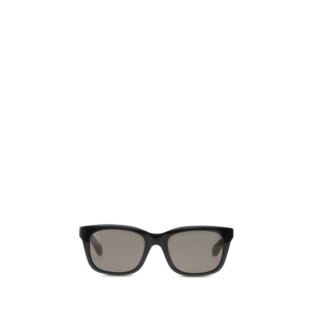Black Acetate SunglassesSunglasses by Balenciaga are made of acetate and feature a square, modern and distinctive shape. On the side is the brand’s signature, a detail that emphasizes its exclusivity. The lenses are made of Bio-Nylon, an innovative materi