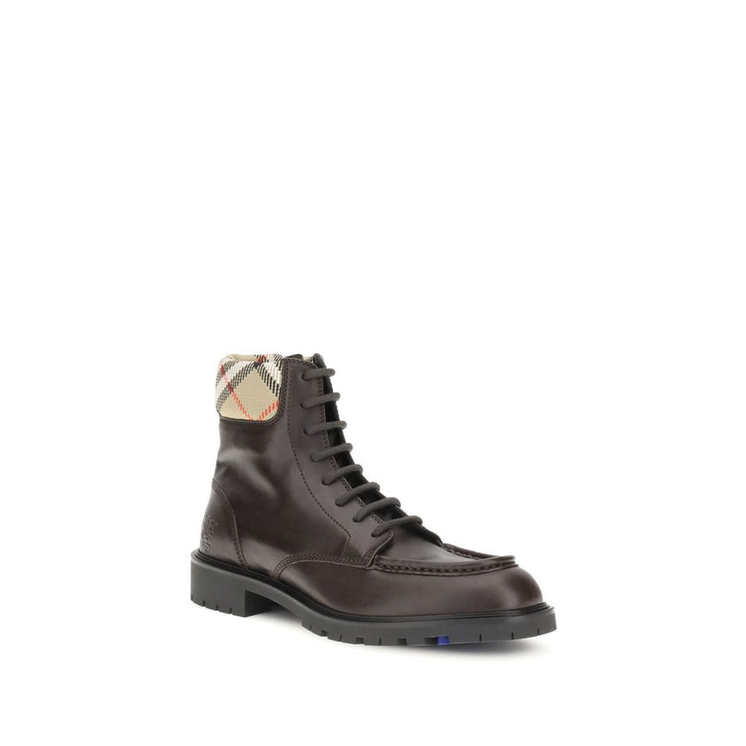 Brown Calf Leather Bos Taurus Lace-Up BootsBurberry’s Rogue amphibious Ankle Boots combine functionality with iconic details. Crafted in a rugged silhouette, they are decorated with the Equestrian Knight Design embossed on the side and complemented by a p