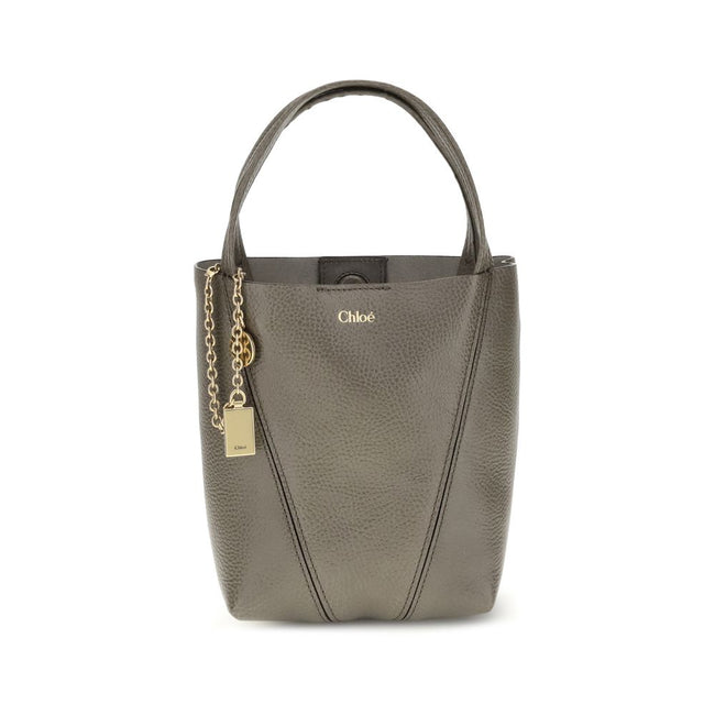 Gray Calf Leather Bos Taurus Shoulder BagThe Spin Shoulder Bag by Chloé, crafted by shiny grained leather, features an elegant design with two flat top handles and an adjustable shoulder strap. The closure is secured by a magnetic button, while the detail