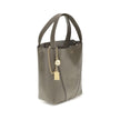 Gray Calf Leather Bos Taurus Shoulder BagThe Spin Shoulder Bag by Chloé, crafted by shiny grained leather, features an elegant design with two flat top handles and an adjustable shoulder strap. The closure is secured by a magnetic button, while the detail
