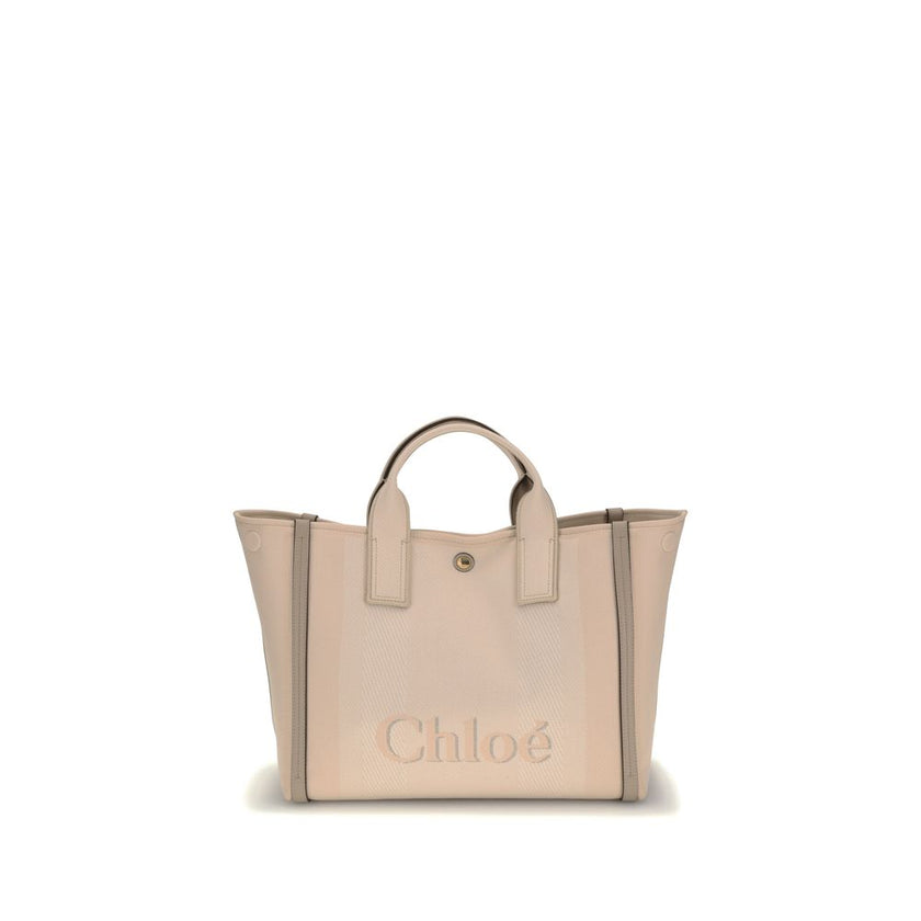 Beige Cotton HandbagChloé’s Carry Handbag is a refined and versatile accessory made of cotton with contrasting leather details that accentuate its elegance. The snap top closure provides practicality, while the double flat handles and leather extension on