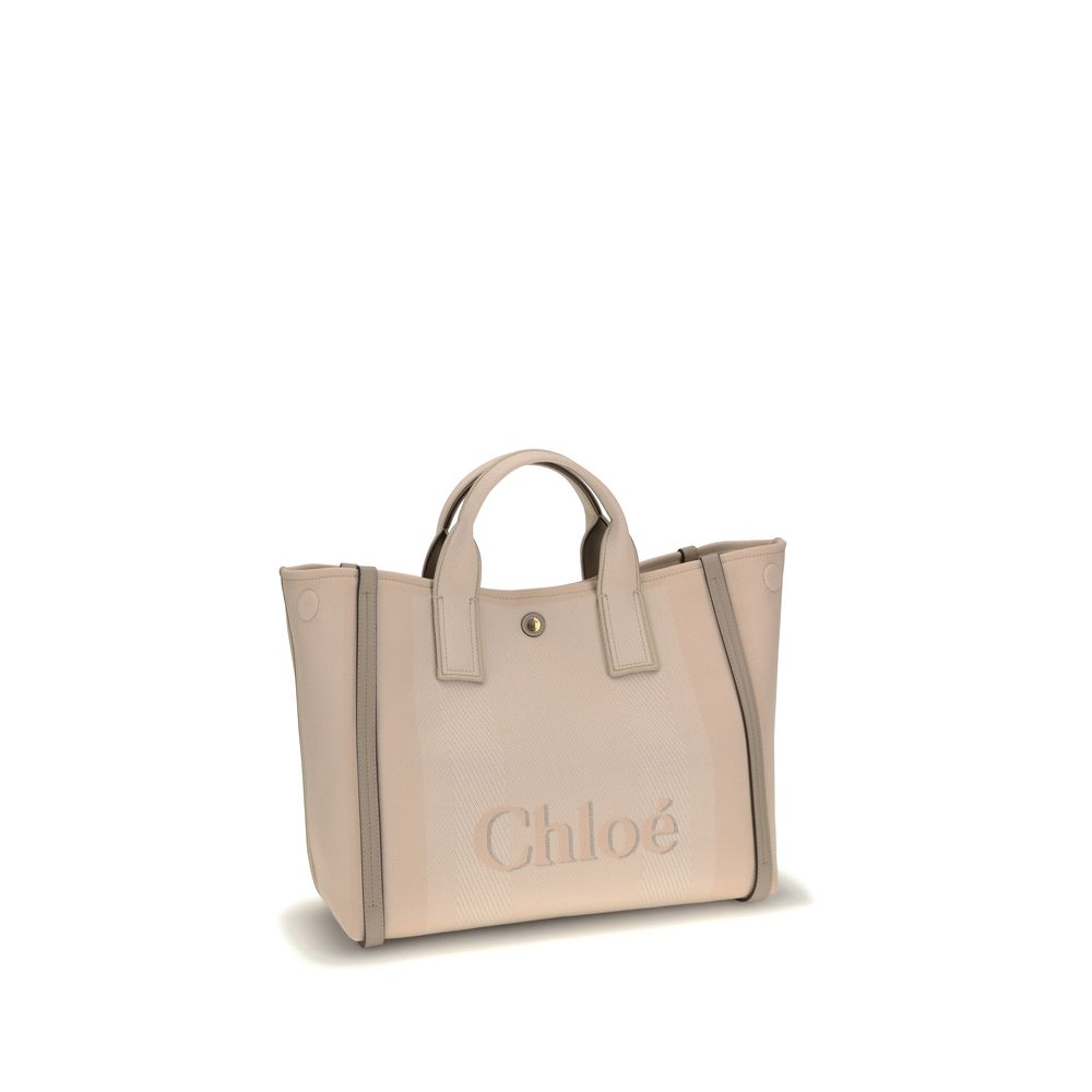 Beige Cotton HandbagChloé’s Carry Handbag is a refined and versatile accessory made of cotton with contrasting leather details that accentuate its elegance. The snap top closure provides practicality, while the double flat handles and leather extension on
