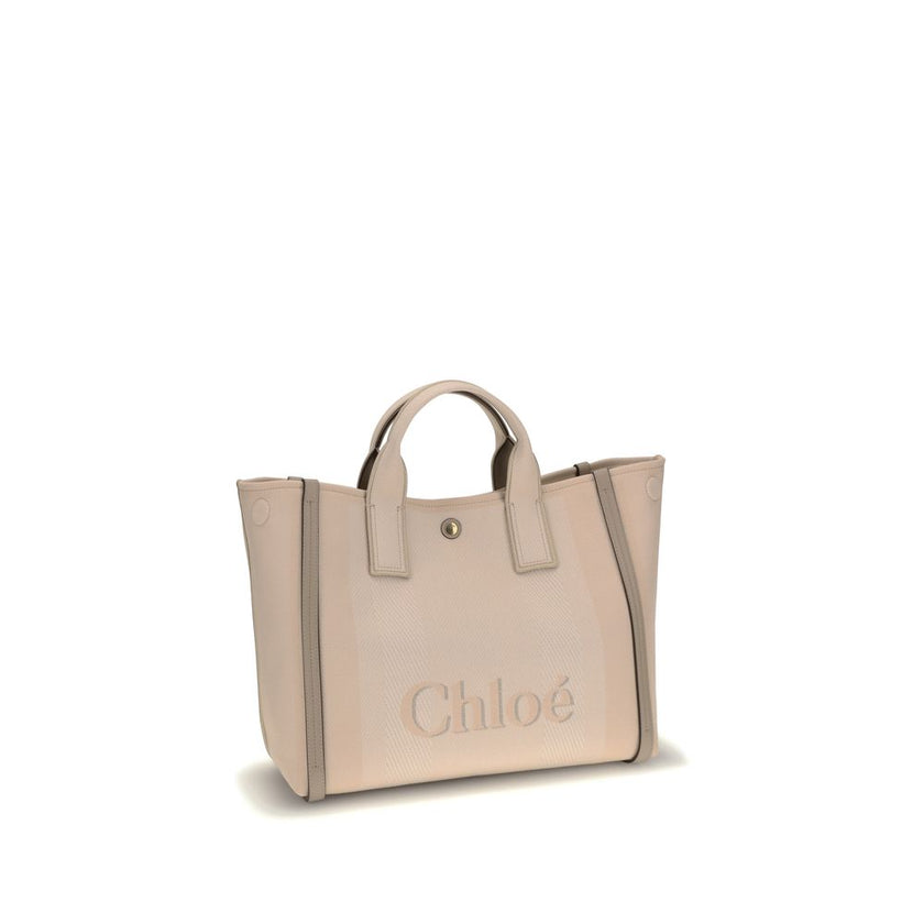 Beige Cotton HandbagChloé’s Carry Handbag is a refined and versatile accessory made of cotton with contrasting leather details that accentuate its elegance. The snap top closure provides practicality, while the double flat handles and leather extension on