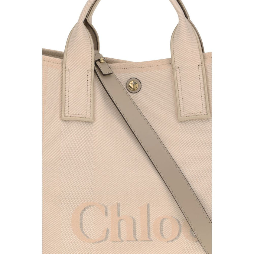 Beige Cotton HandbagChloé’s Carry Handbag is a refined and versatile accessory made of cotton with contrasting leather details that accentuate its elegance. The snap top closure provides practicality, while the double flat handles and leather extension on