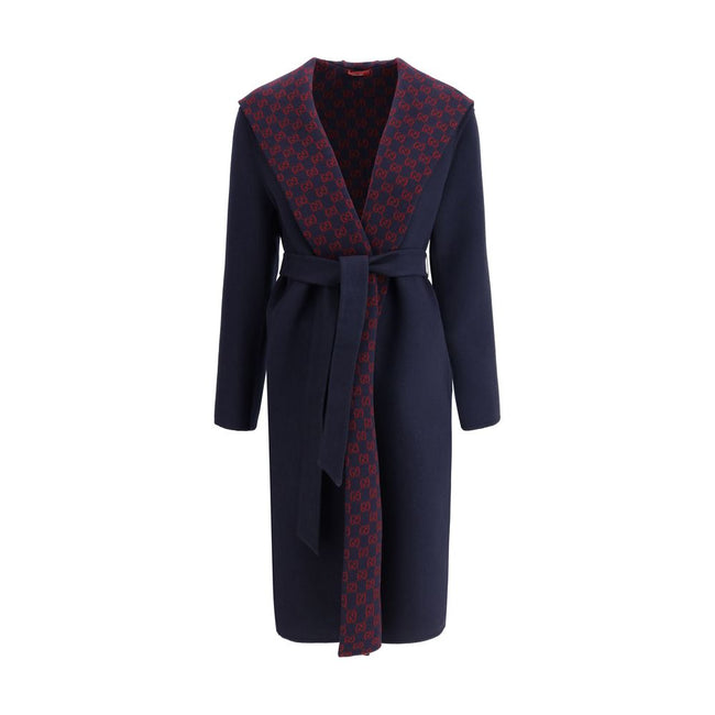 Blue Wool CoatGucci’s wool Coat is a long style with a timelessly elegant design. Featuring a hood and matching removable and knotted sash, it combines practicality and style. The two side welt pockets add functionality to the garment, while the iconic Gu