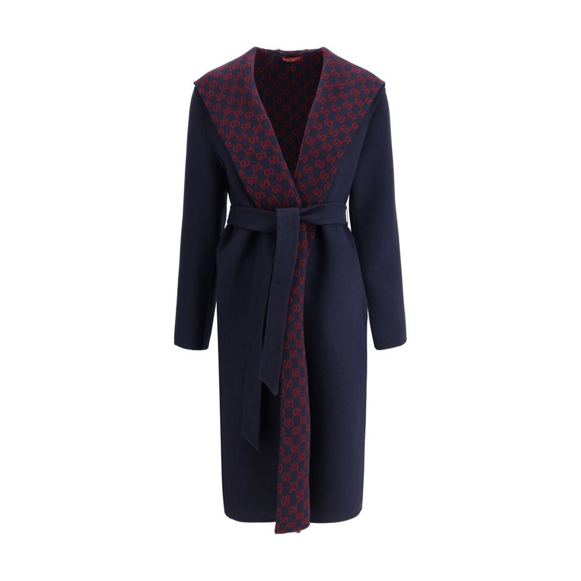 Blue Wool CoatGucci’s wool Coat is a long style with a timelessly elegant design. Featuring a hood and matching removable and knotted sash, it combines practicality and style. The two side welt pockets add functionality to the garment, while the iconic Gu