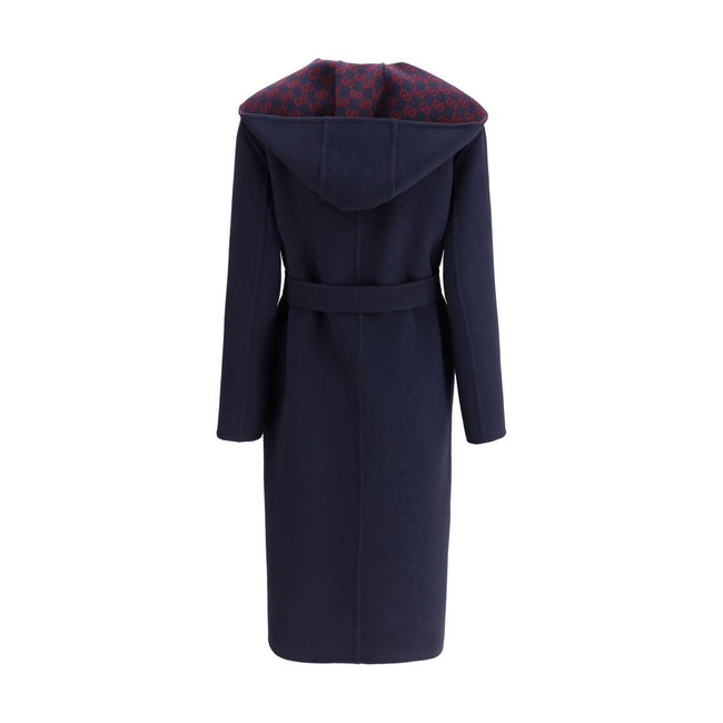 Blue Wool CoatGucci’s wool Coat is a long style with a timelessly elegant design. Featuring a hood and matching removable and knotted sash, it combines practicality and style. The two side welt pockets add functionality to the garment, while the iconic Gu