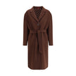 Brown Wool CoatGucci’s silk and wool reversible Coat is a refined and versatile piece, perfect for enhancing any look with a distinctive touch. Made of brown silk wool on one side and brown and light pink GG patterned silk wool on the other, it offers two