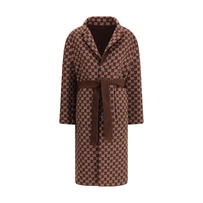 Brown Wool CoatGucci’s silk and wool reversible Coat is a refined and versatile piece, perfect for enhancing any look with a distinctive touch. Made of brown silk wool on one side and brown and light pink GG patterned silk wool on the other, it offers two