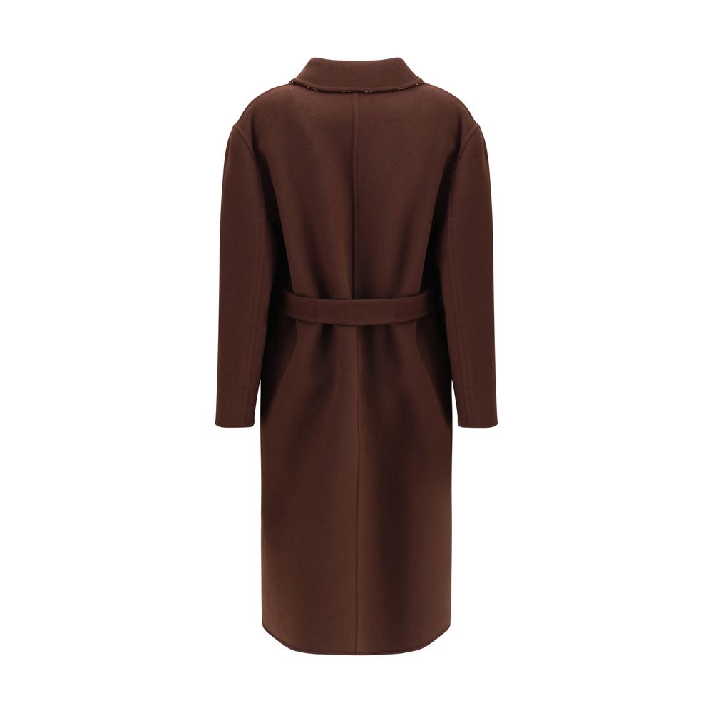 Brown Wool CoatGucci’s silk and wool reversible Coat is a refined and versatile piece, perfect for enhancing any look with a distinctive touch. Made of brown silk wool on one side and brown and light pink GG patterned silk wool on the other, it offers two
