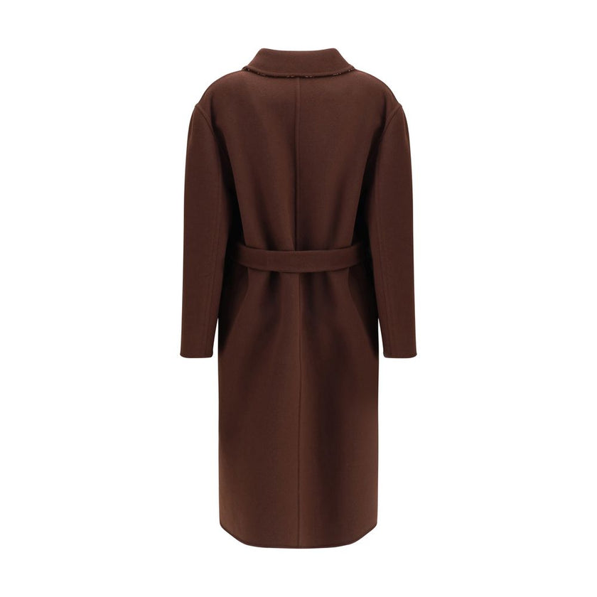 Brown Wool CoatGucci’s silk and wool reversible Coat is a refined and versatile piece, perfect for enhancing any look with a distinctive touch. Made of brown silk wool on one side and brown and light pink GG patterned silk wool on the other, it offers two
