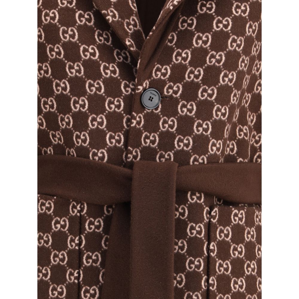Brown Wool CoatGucci’s silk and wool reversible Coat is a refined and versatile piece, perfect for enhancing any look with a distinctive touch. Made of brown silk wool on one side and brown and light pink GG patterned silk wool on the other, it offers two