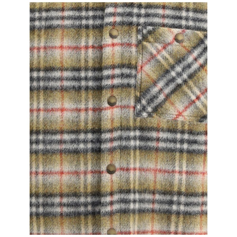 Multicolor Wool CoatBurberry’s Check wool Jacket features a classic collar and a front snap-button closure. Featuring the iconic check pattern, it is completed with a patch pocket on the front for a timeless look with British style. Season: AW25 Fit: Slim