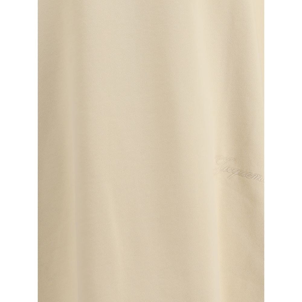 Cotton T-ShirtJacquemus’ cotton T-Shirt is an essential garment reinterpreted with the brand’s unmistakable style. Featuring an oversized cut, it offers a relaxed and contemporary fit, ideal for casual looks with a strong character. The ribbed crew neck e