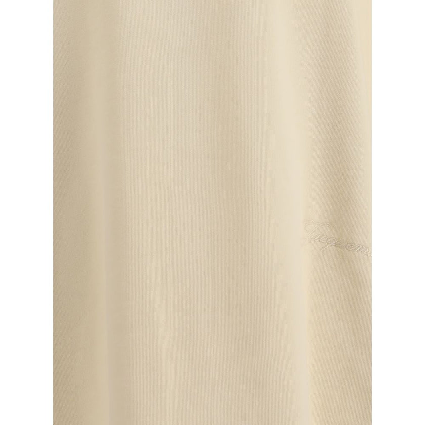 Cotton T-ShirtJacquemus’ cotton T-Shirt is an essential garment reinterpreted with the brand’s unmistakable style. Featuring an oversized cut, it offers a relaxed and contemporary fit, ideal for casual looks with a strong character. The ribbed crew neck e