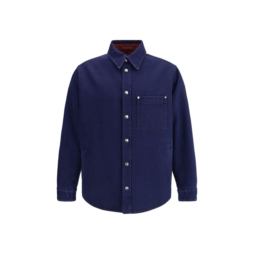 Blue Denim ShirtGucci’s reversible Shirt combines dark blue délavé denim on one side and soft red and blue brushed GG flannel on the other. Featuring a pointed collar, chest pocket, side pockets and long sleeves, it has a front closure with Gucci metal bu