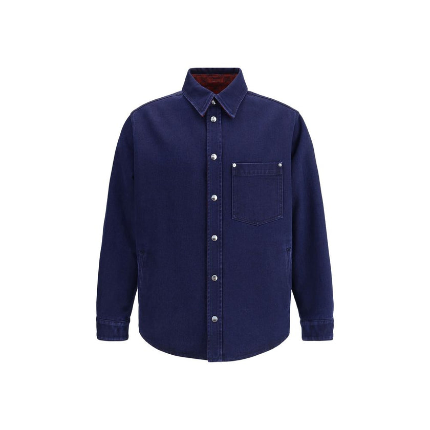 Blue Denim ShirtGucci’s reversible Shirt combines dark blue délavé denim on one side and soft red and blue brushed GG flannel on the other. Featuring a pointed collar, chest pocket, side pockets and long sleeves, it has a front closure with Gucci metal bu