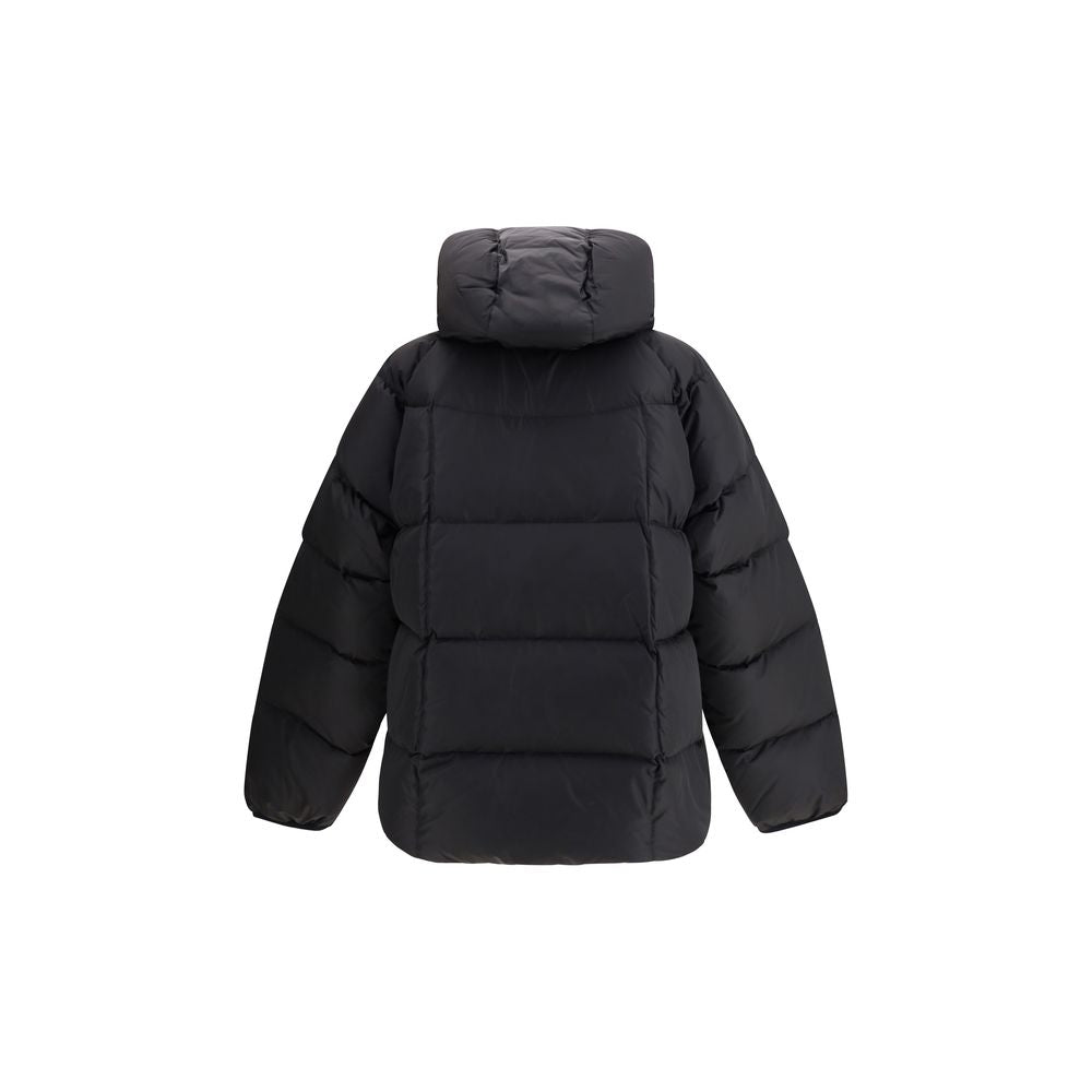 Black Polyamide CoatThe 3D long nylon Down Jacket by Dsquared2 is designed to offer maximum protection and style during the cold season. Featuring a quilted and padded design, it features a wrap-around hood, maxi zippered pockets ideal for storing essenti