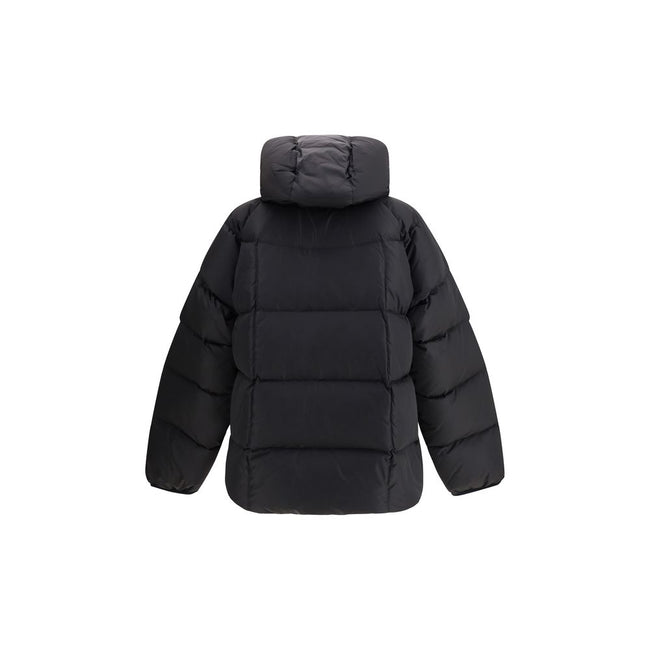 Black Polyamide CoatThe 3D long nylon Down Jacket by Dsquared2 is designed to offer maximum protection and style during the cold season. Featuring a quilted and padded design, it features a wrap-around hood, maxi zippered pockets ideal for storing essenti