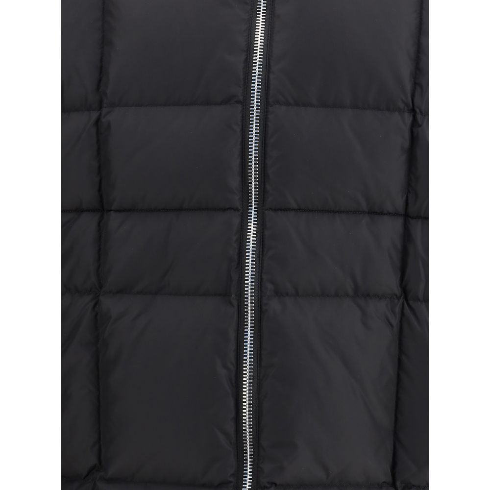 Black Polyamide CoatThe 3D long nylon Down Jacket by Dsquared2 is designed to offer maximum protection and style during the cold season. Featuring a quilted and padded design, it features a wrap-around hood, maxi zippered pockets ideal for storing essenti