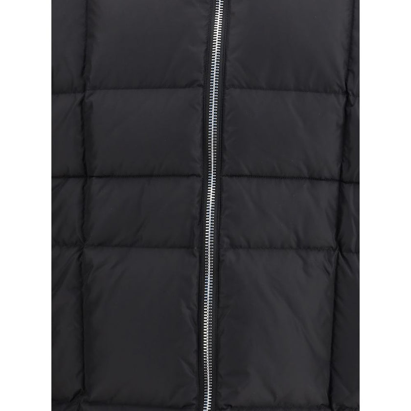 Black Polyamide CoatThe 3D long nylon Down Jacket by Dsquared2 is designed to offer maximum protection and style during the cold season. Featuring a quilted and padded design, it features a wrap-around hood, maxi zippered pockets ideal for storing essenti