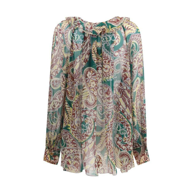 Multicolor Silk Pattern ShirtMade of lightweight silk crepon with a see-through effect, Etro’s shirt is distinguished by its ethereal elegance and the house’s iconic all over Paisley print. The deep V-neckline is enhanced by delicate tone-on-tone ruffles,