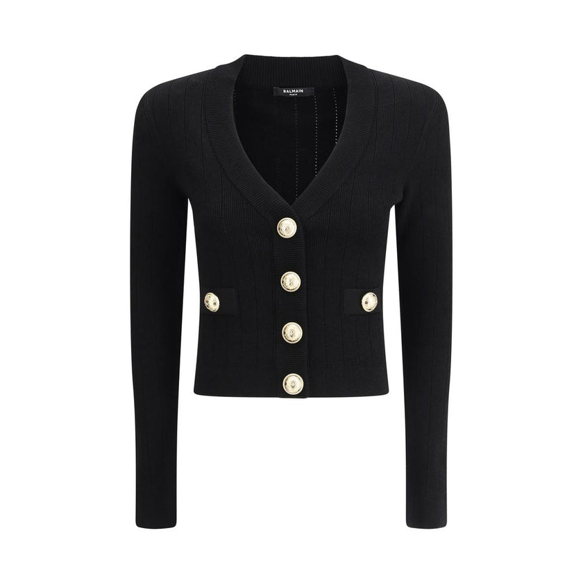 Black Viscose CardiganCardigan by Balmain, cropped design, v-neck on front, closure by embossed buttons, close fit, monochrome pattern. Season: AW25 Fit: Slim Composition: 83% Viscose 17% Polyester MADE IN FRANCEBlack Viscose Cardigan${tagsBalmainAulae Ca
