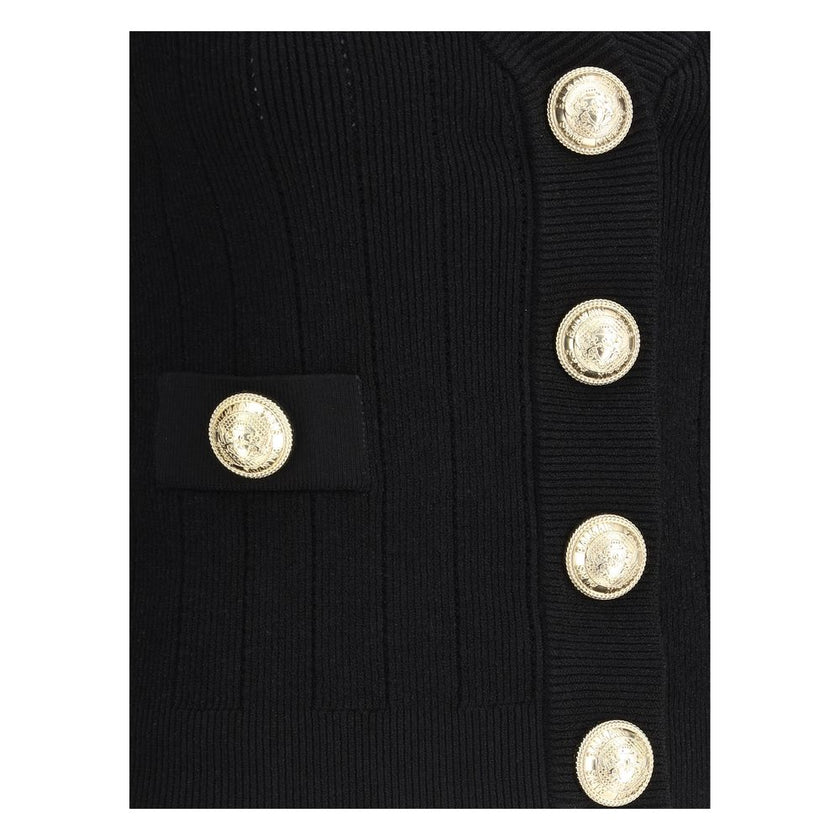 Black Viscose CardiganCardigan by Balmain, cropped design, v-neck on front, closure by embossed buttons, close fit, monochrome pattern. Season: AW25 Fit: Slim Composition: 83% Viscose 17% Polyester MADE IN FRANCEBlack Viscose Cardigan${tagsBalmainAulae Ca