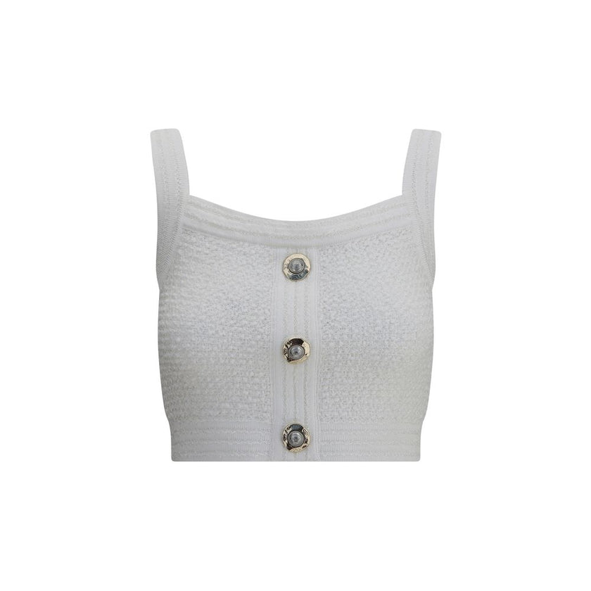 White Polyamide TopBalmain’s tweed crop Top is a bold and refined piece featuring a square neckline and thick straps that enhance the silhouette. Crafted in the Maison’s iconic tweed, it features a front closure with embossed buttons, a distinctive detail