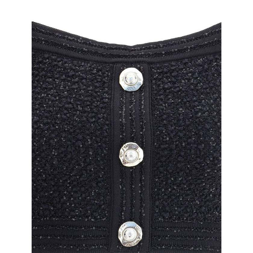 Black Polyamide TopBalmain’s tweed crop Top is a bold and refined piece featuring a square neckline and thick straps that enhance the silhouette. Crafted in the Maison’s iconic tweed, it features a front closure with embossed buttons, a distinctive detail