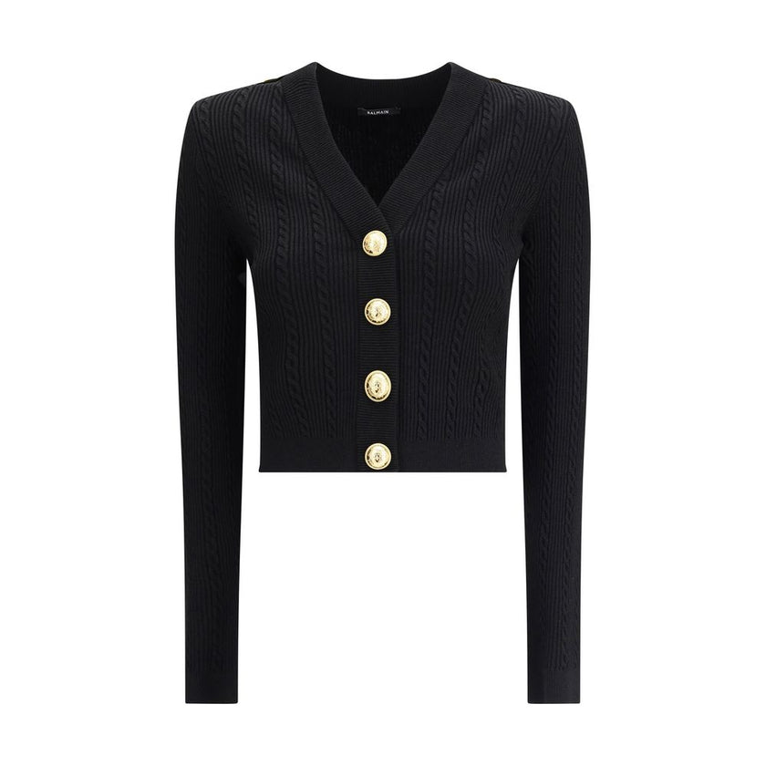 Black Viscose CardiganBalmain’s Ribbed and braided Cardigan combines elegance and structure in a distinctive design. Featuring a V-neckline, it features structured shoulders with decorative tabs and buttons, recalling the military aesthetic dear to the Ma