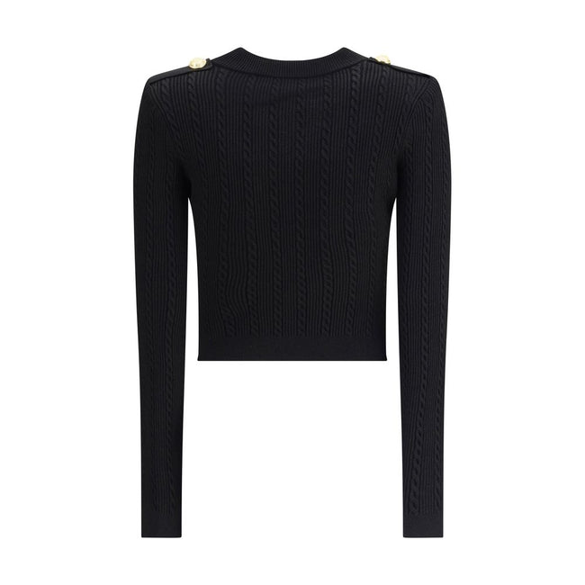 Black Viscose CardiganBalmain’s Ribbed and braided Cardigan combines elegance and structure in a distinctive design. Featuring a V-neckline, it features structured shoulders with decorative tabs and buttons, recalling the military aesthetic dear to the Ma