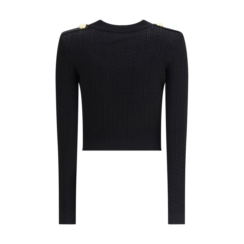 Black Viscose CardiganBalmain’s Ribbed and braided Cardigan combines elegance and structure in a distinctive design. Featuring a V-neckline, it features structured shoulders with decorative tabs and buttons, recalling the military aesthetic dear to the Ma