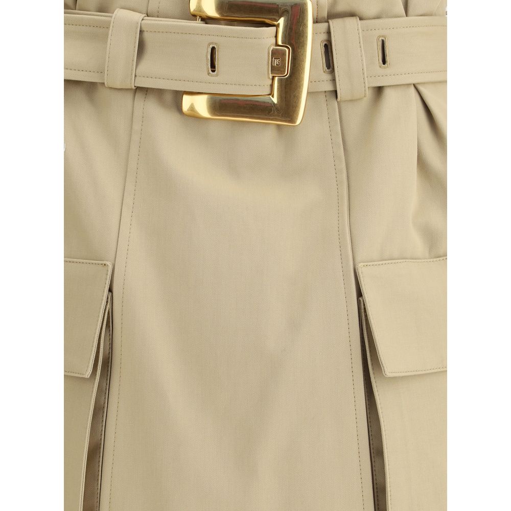 Beige Cotton Mini SkirtBalmain’s cargo Miniskirt reinterprets utility style with a sophisticated twist. Featuring a removable belt with a PB engraved gold metal Anthem buckle, it has two side pockets with gussets and a flap. The back closure with exposed