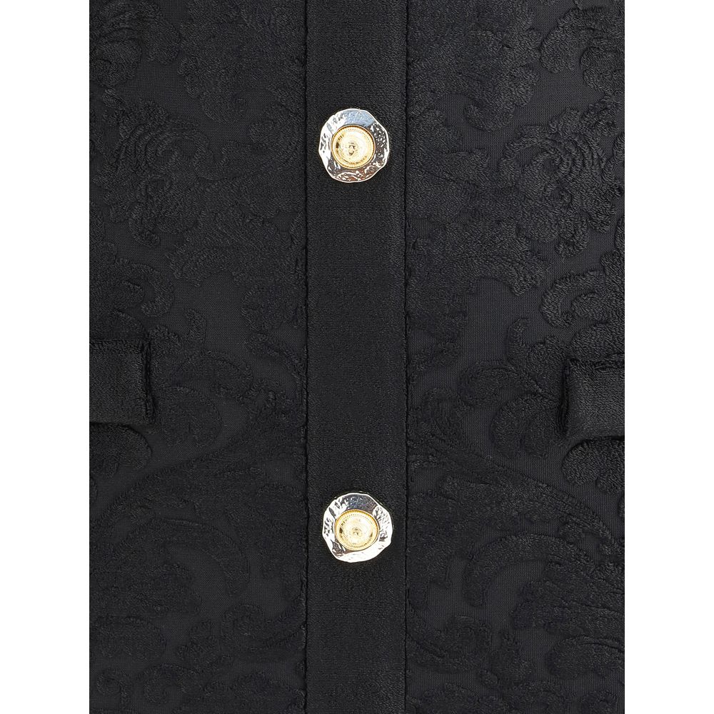 Black Viscose Cocktail DressBalmain’s Baroque short Dress combines elegance and character in a refined design. Made of bouclé fabric with a rich baroque pattern, it features an American collar that enhances the silhouette and a back zipper closure. Gold e