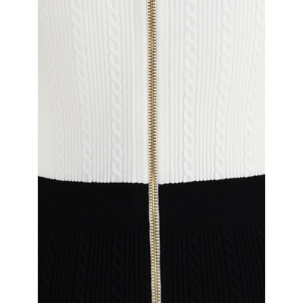 Multicolor Viscose Casual DressBalmain’s Braided Pattern midi Dress is an elegant and refined piece featuring a V-neckline and short sleeves. It features a front closure with embossed buttons, the Maison’s signature detail, and a back zipper for a perfect
