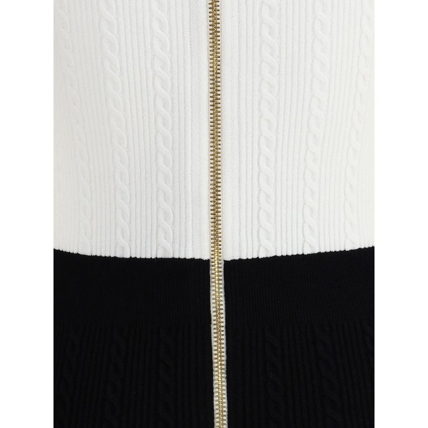 Multicolor Viscose Casual DressBalmain’s Braided Pattern midi Dress is an elegant and refined piece featuring a V-neckline and short sleeves. It features a front closure with embossed buttons, the Maison’s signature detail, and a back zipper for a perfect