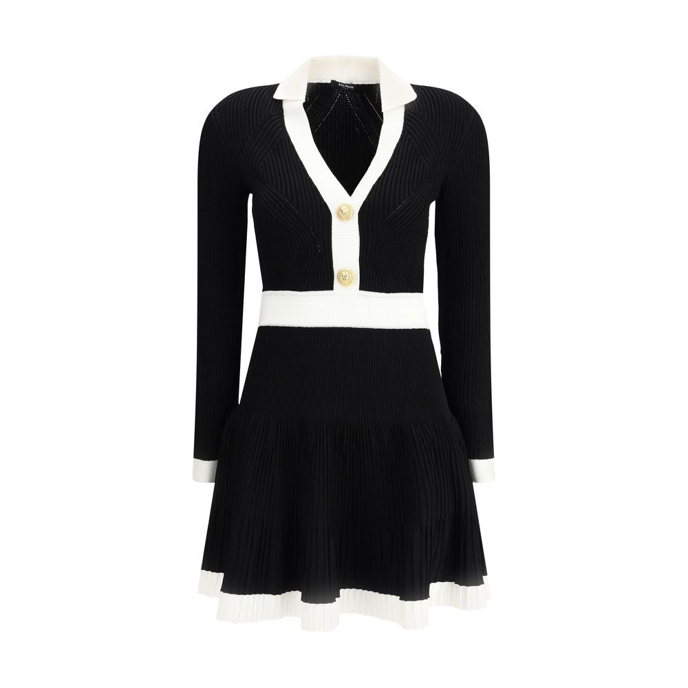 Black Viscose Casual DressBalmain’s Knit Short Dress combines structured elegance and comfort. Made of stretch knit, it features a feminine silhouette with a flared skirt, collar and ribbed trim. The front closure is embellished with embossed buttons, the