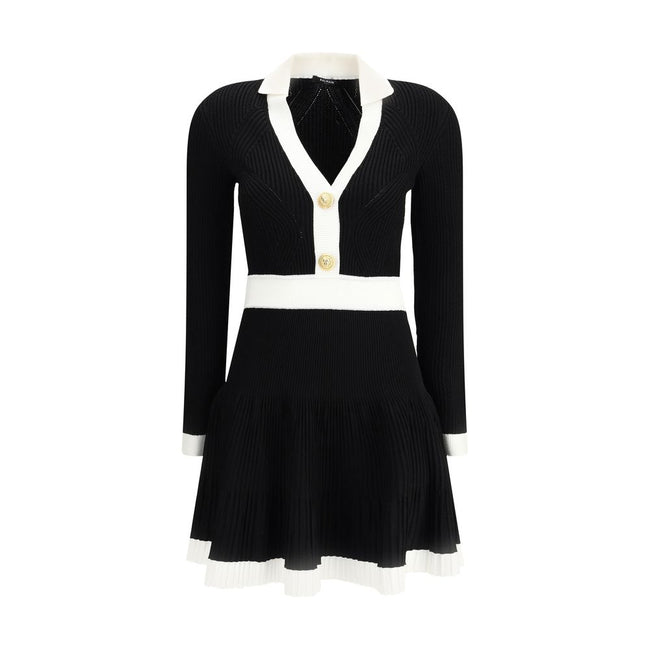 Black Viscose Casual DressBalmain’s Knit Short Dress combines structured elegance and comfort. Made of stretch knit, it features a feminine silhouette with a flared skirt, collar and ribbed trim. The front closure is embellished with embossed buttons, the