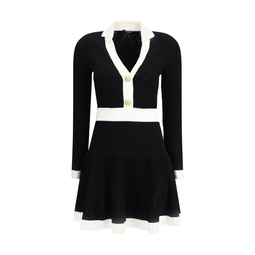 Black Viscose Casual DressBalmain’s Knit Short Dress combines structured elegance and comfort. Made of stretch knit, it features a feminine silhouette with a flared skirt, collar and ribbed trim. The front closure is embellished with embossed buttons, the