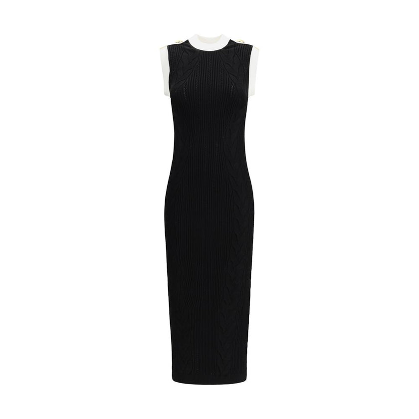 Black Viscose Casual DressBalmain’s Long Dress is a bold and refined garment made of a twisted knit with openwork that enhances the silhouette. The round neckline is framed by a contrasting ribbed finish, also echoed on the armholes. The contrasting strap