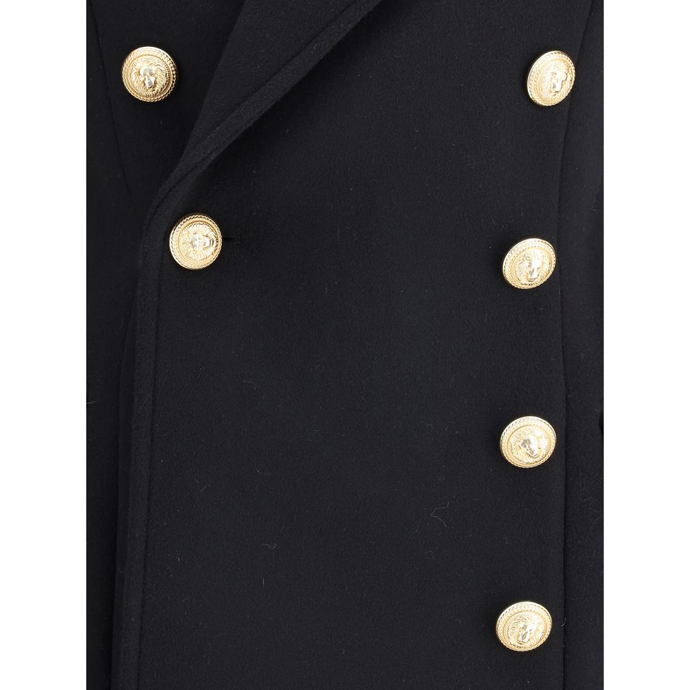 Black Fleece Wool CoatBalmain’s wool and cashmere double-breasted coat is a fine tailored piece, featuring a classic Italian collar and structured shoulders that give it a bold profile. Long sleeves with double flaps and two American-style side flap pocke