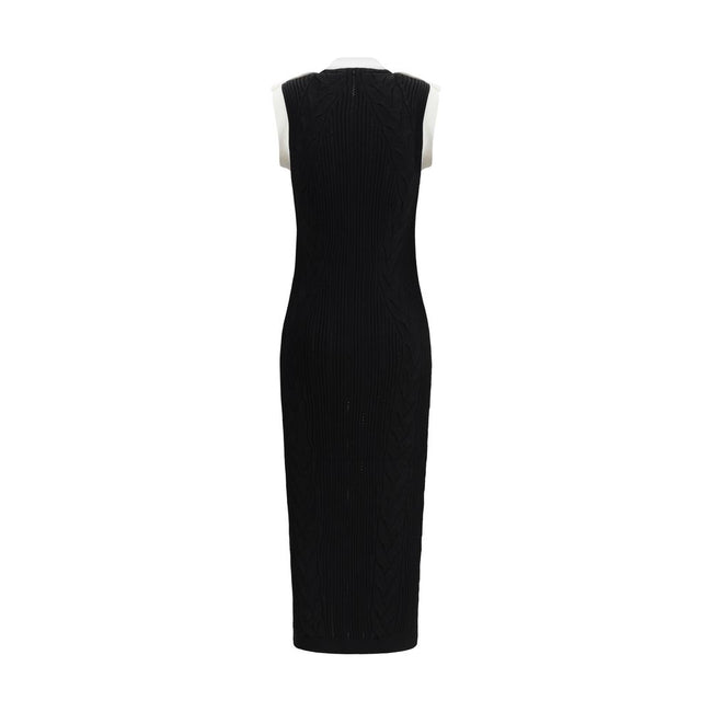 Black Viscose Casual DressBalmain’s Long Dress is a bold and refined garment made of a twisted knit with openwork that enhances the silhouette. The round neckline is framed by a contrasting ribbed finish, also echoed on the armholes. The contrasting strap