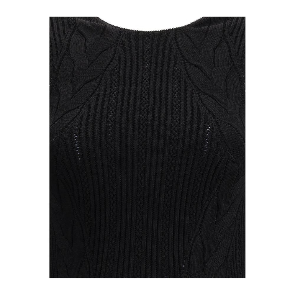 Black Viscose Casual DressBalmain’s Long Dress is a bold and refined garment made of a twisted knit with openwork that enhances the silhouette. The round neckline is framed by a contrasting ribbed finish, also echoed on the armholes. The contrasting strap