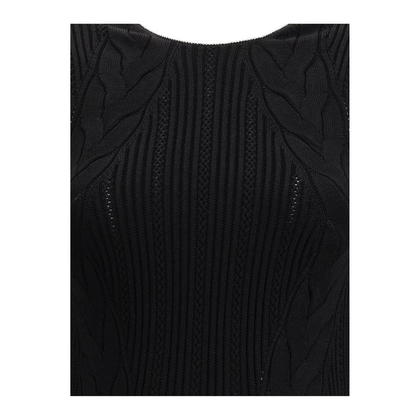 Black Viscose Casual DressBalmain’s Long Dress is a bold and refined garment made of a twisted knit with openwork that enhances the silhouette. The round neckline is framed by a contrasting ribbed finish, also echoed on the armholes. The contrasting strap