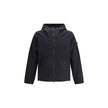 Black Cotton Shell JacketStone Island’s Cotton Jacket features an adjustable drawstring hood and front zipper closure. The model is completed with two patch pockets on the front and the iconic patch on the left arm, a distinctive symbol of the brand. Seas