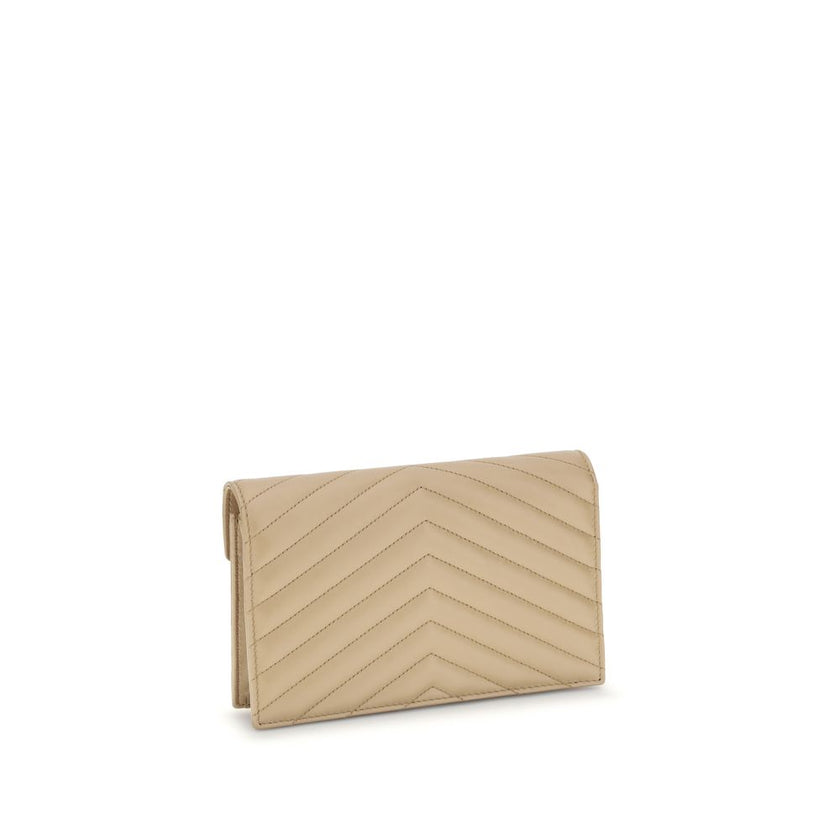 Wallet with shoulder strapSaint Laurent Wallet made of fine lambskin leather with quilted effect, with an elegant and sophisticated design. The front closure is entrusted to a magnetic flap embellished with the iconic embossed YSL logo plaque. Complemente