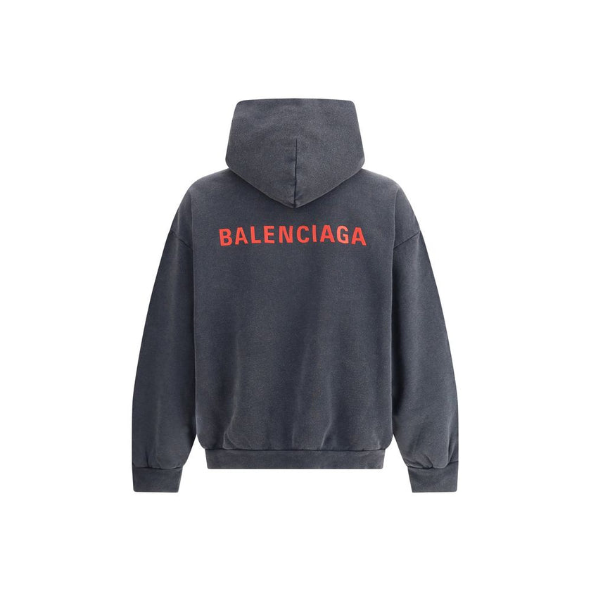 Gray Cotton SweatshirtBalenciaga’s hooded Sweatshirt combines comfort and contemporary style. Featuring an embroidered logo on the front, it features a practical kangaroo pocket, ribbed cuffs and hem ensuring a snug, finished fit. An iconic garment for an