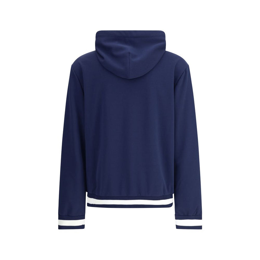 Blue Polyester SweatshirtGucci’s Jersey Hoodie combines comfort and sporty style with the house’s iconic details. Decorated with a striped print and the Gucci logo, it features a fixed hood with drawstring, long sleeves and two side pockets. Striped ribbe